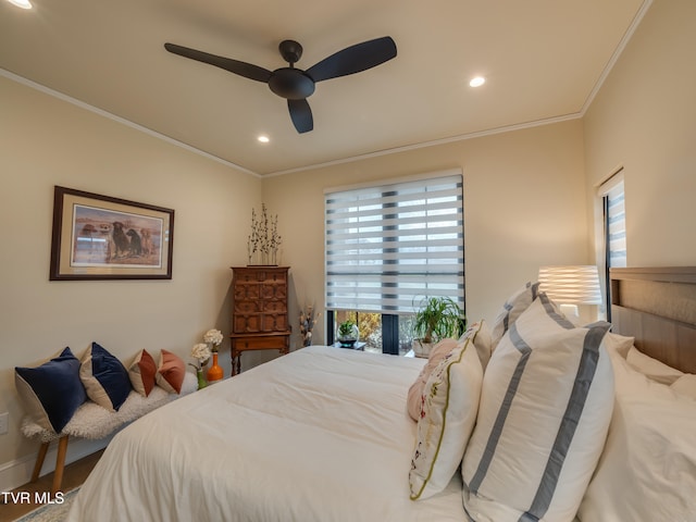 bedroom featuring hardwood / wood-style flooring, ceiling fan, and crown molding