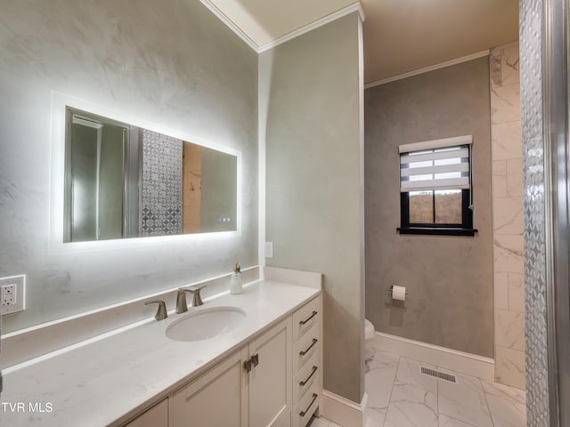 bathroom with vanity, toilet, and crown molding