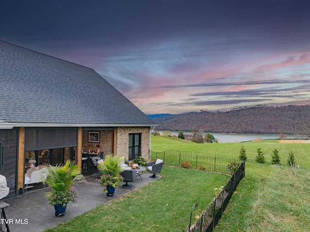 175 Deer Ridge Ct, Butler, TN 37640 - yard at dusk with a patio area, a mountain view, and outdoor lounge area