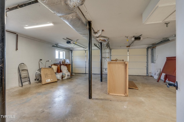 garage with electric panel and a garage door opener