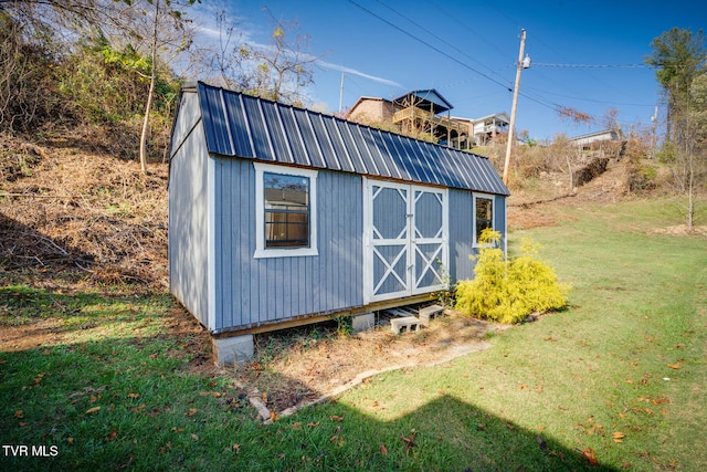 view of outdoor structure with a lawn