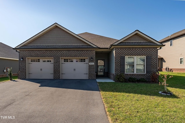 view of front of house featuring a garage and a front yard