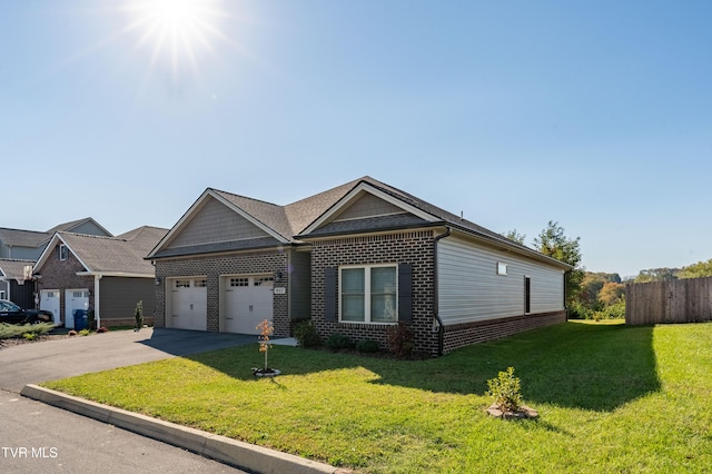 view of front of property with a front lawn and a garage