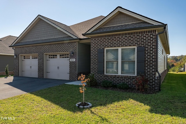 view of front facade with a garage and a front lawn