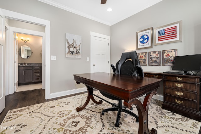 office with dark hardwood / wood-style flooring, ceiling fan, and crown molding