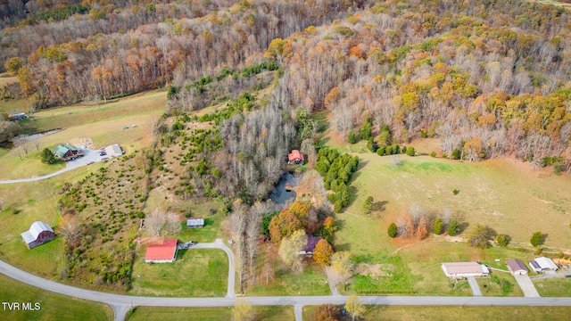 bird's eye view featuring a wooded view