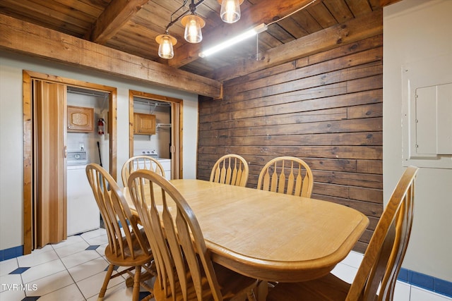 dining area featuring beamed ceiling, wood ceiling, light tile patterned floors, and washer / clothes dryer