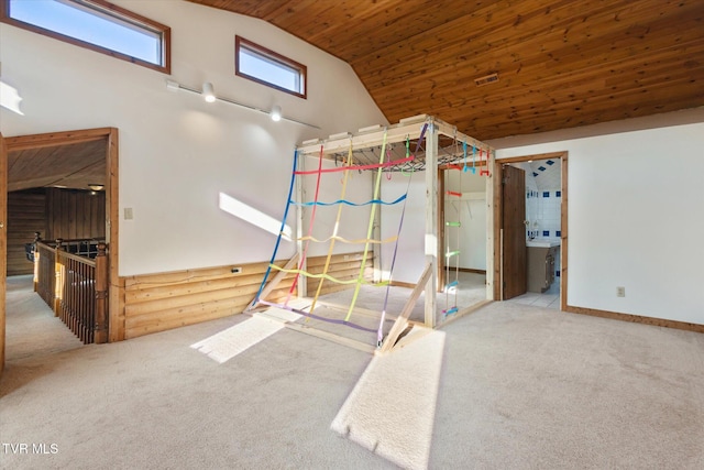 unfurnished bedroom with high vaulted ceiling, ensuite bath, wooden ceiling, and carpet floors