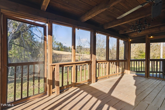 sunroom with wooden ceiling and beamed ceiling