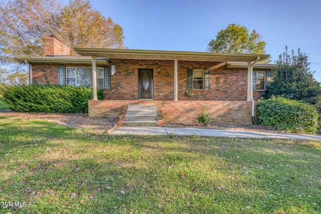 single story home featuring a front lawn