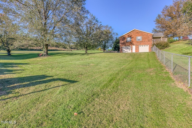 view of yard with a garage