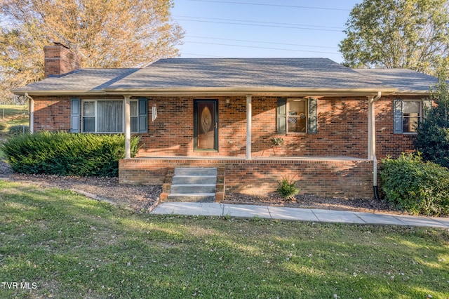 ranch-style home with a front lawn and a porch