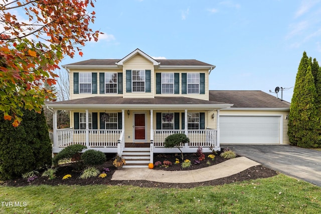 colonial-style house with covered porch and a garage