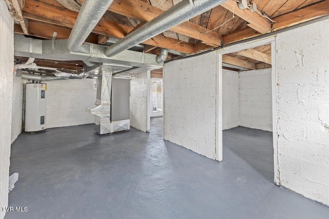 basement featuring heating unit and electric water heater