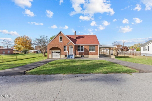 view of front of house with a front yard and a carport