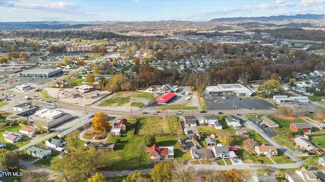 birds eye view of property featuring a mountain view