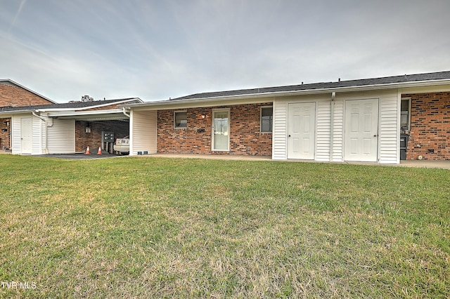 view of front facade with a front yard and a patio