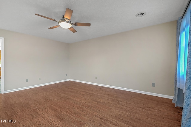 unfurnished room featuring hardwood / wood-style floors, a textured ceiling, and ceiling fan