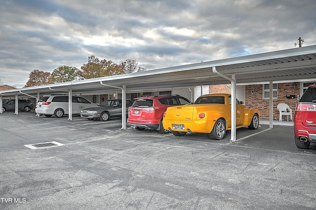 view of vehicle parking featuring a carport