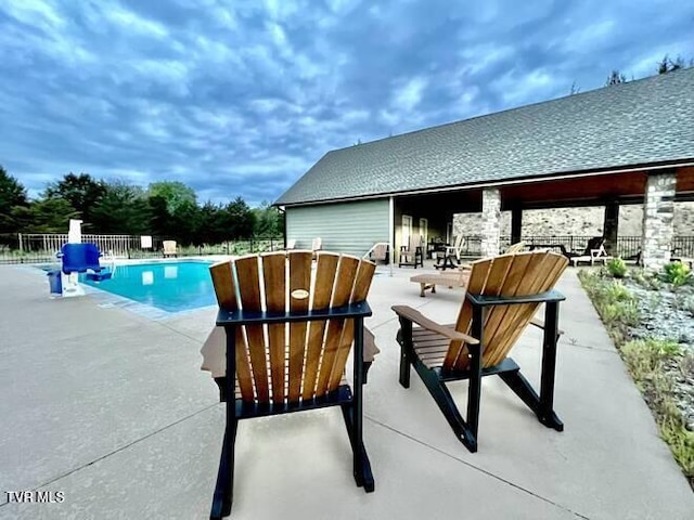 view of swimming pool with a patio