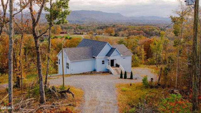 birds eye view of property featuring a mountain view