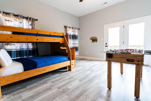 bedroom with ceiling fan and hardwood / wood-style flooring