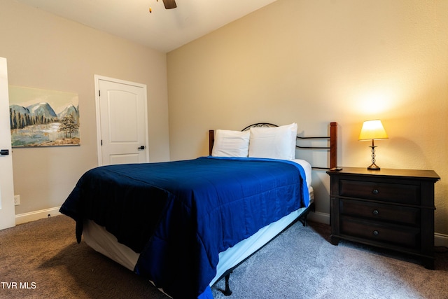 carpeted bedroom with ceiling fan and vaulted ceiling