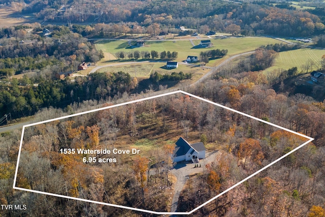 birds eye view of property featuring a rural view