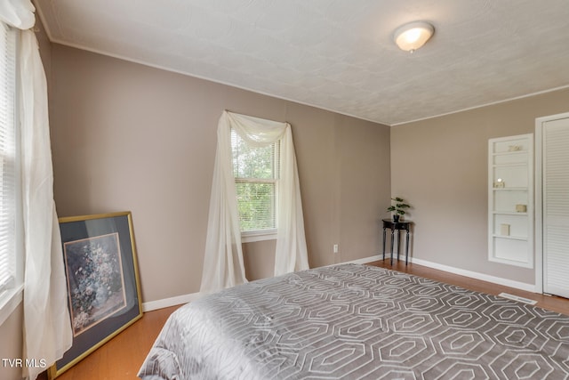 bedroom featuring hardwood / wood-style floors