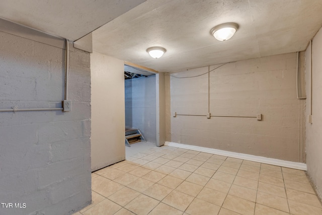 basement featuring light tile patterned floors