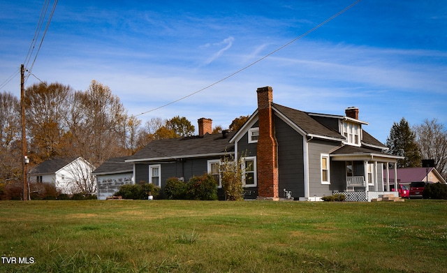 back of property with a porch and a lawn