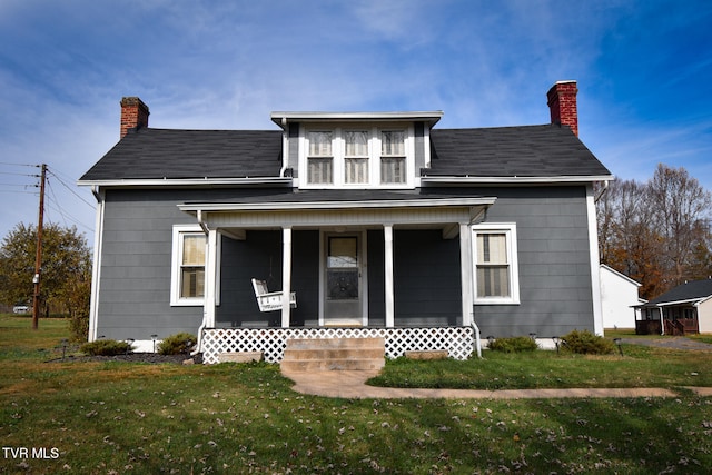 view of front of property featuring a porch and a front yard