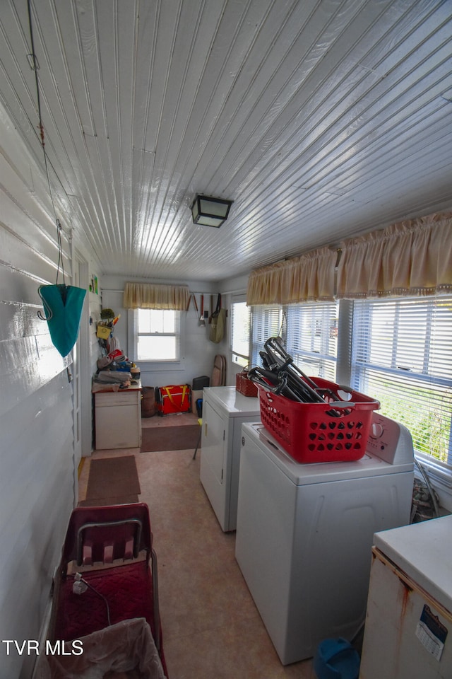 washroom with washing machine and clothes dryer