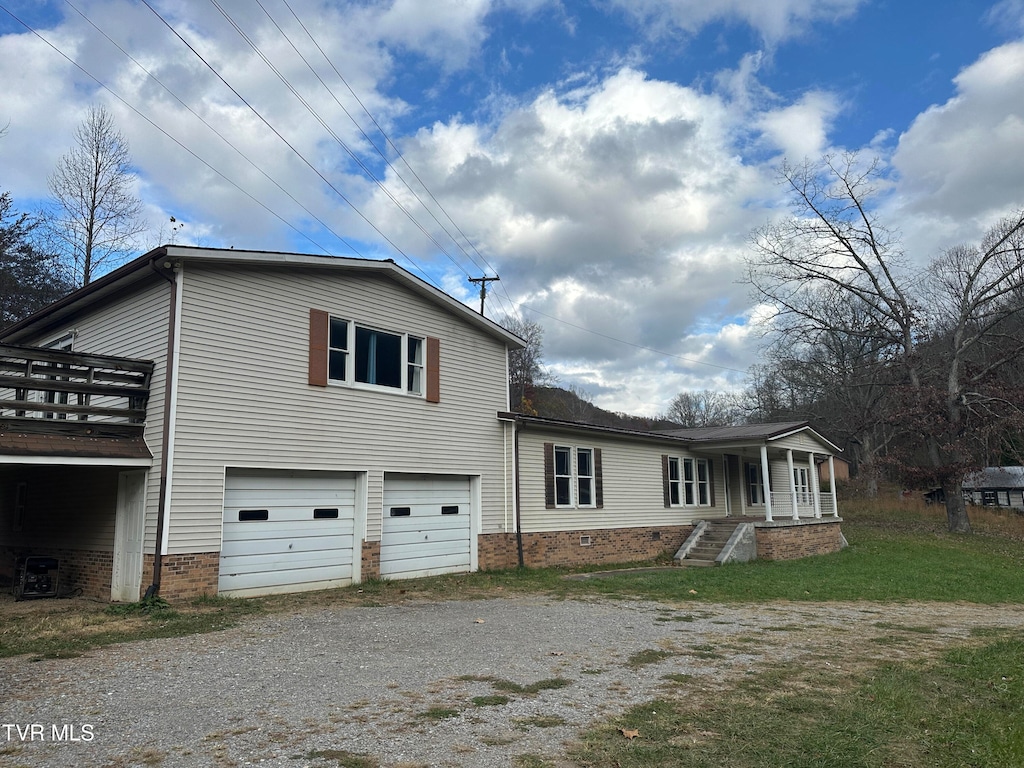 view of side of property featuring a garage