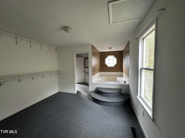 11511 Meade Fork Rd, Pound, VA 24279 - bathroom featuring a textured ceiling and a garden tub