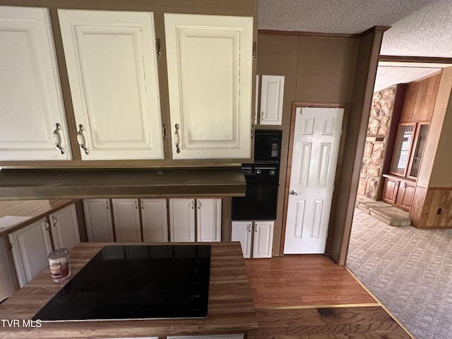 11511 Meade Fork Rd, Pound, VA 24279 - kitchen with black appliances, a textured ceiling, and dark wood-style flooring