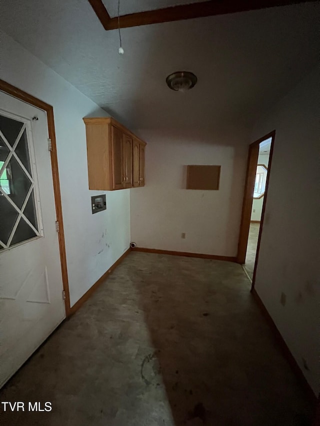 washroom with cabinets and hookup for a washing machine