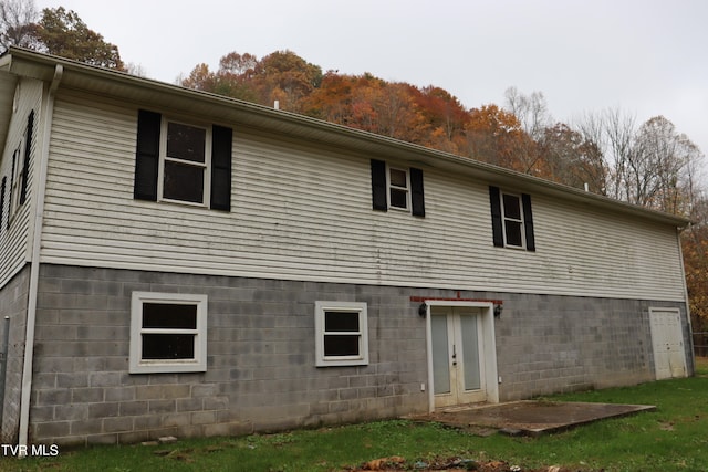 back of property featuring french doors