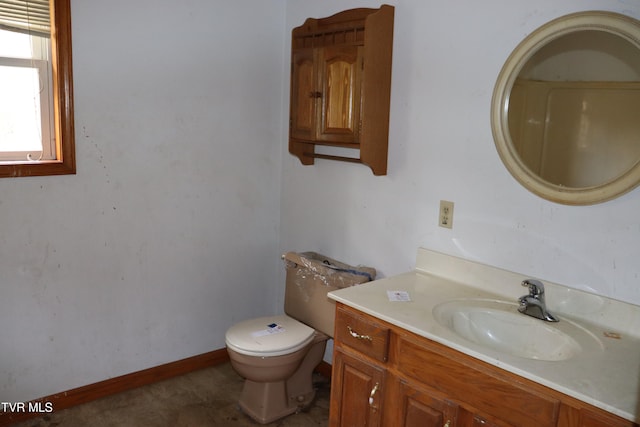 bathroom featuring toilet and vanity