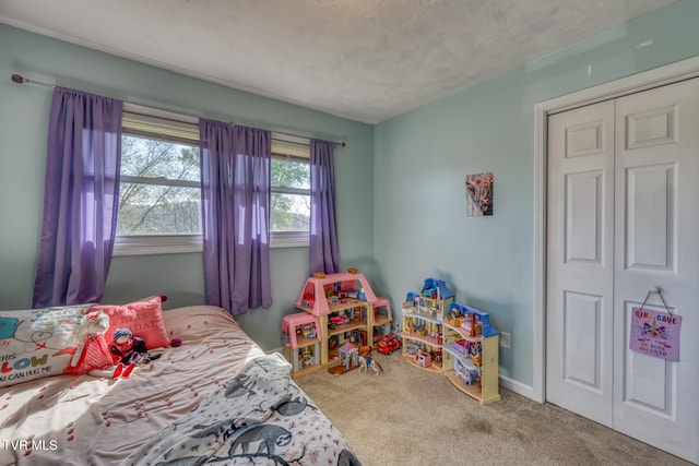 carpeted bedroom featuring a closet