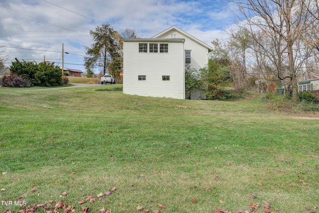 view of property exterior featuring a yard