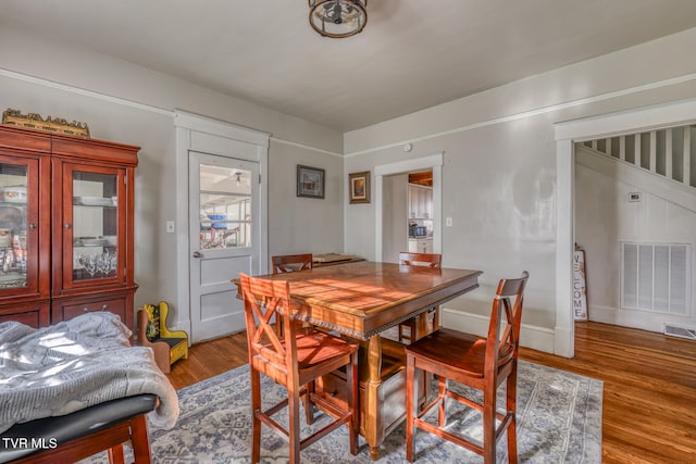 dining room with hardwood / wood-style floors