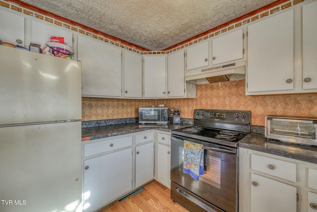 kitchen featuring light hardwood / wood-style floors, a textured ceiling, white fridge, electric range, and white cabinetry