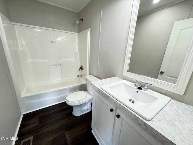 full bathroom with toilet, vanity, shower / bath combination, and wood-type flooring