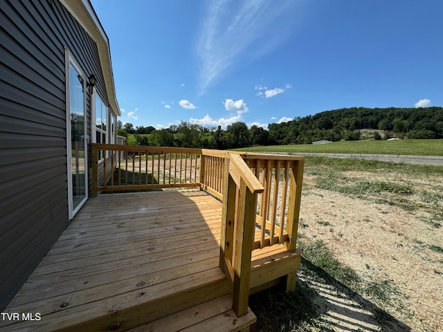 wooden terrace with a rural view