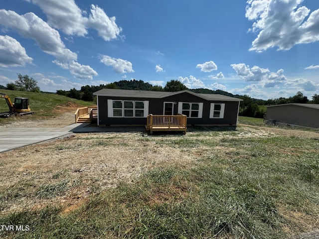 view of front of home with a wooden deck