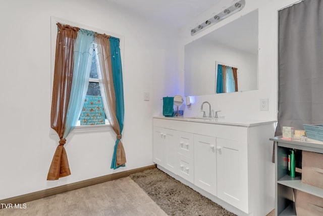 bathroom featuring hardwood / wood-style floors and vanity