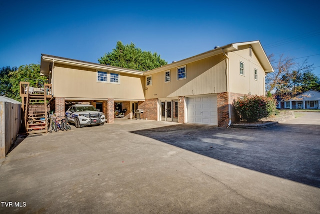 view of front facade with a garage and a carport