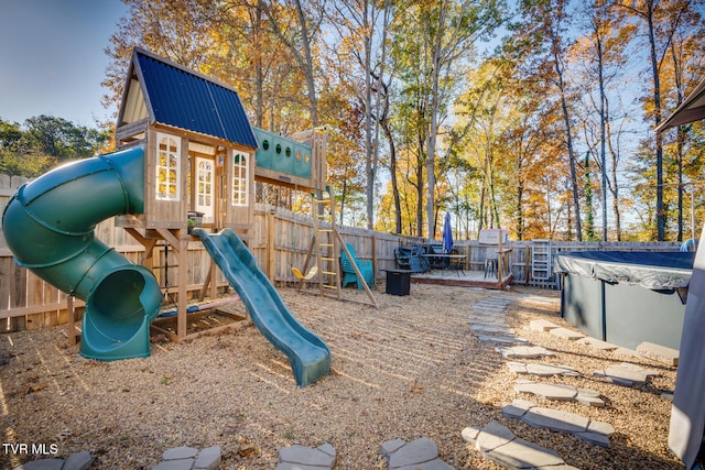 view of play area with a covered pool