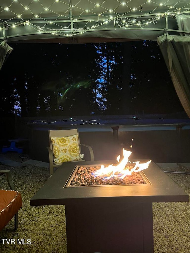 exterior details with an outdoor fire pit